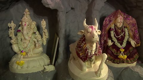 Ceramic Statues of Hindu Gods Ganesha,  Nandi and Goddess Parvathi in Shiva Temple. Bangalore, India