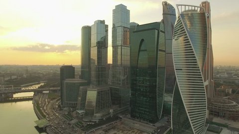 Aerial real time sunset video of Moscow International Business centre. The camera is approaching to the skyscrapers. The concept of business success. 4K, Ultra HD video, DJI Phantom 3 pro.