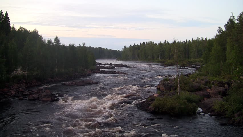 rough river flows through the forest. Scandinavia