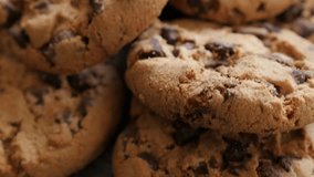 Lot of chip cake cookies with chocolate close-up tilting 4K 3840X2160 30fps UHD footage - Slow tilting on biscuit cookies arranged on table 4K 2160p UltraHD video