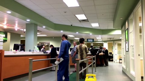 Coquitlam, BC, Canada - November 10, 2015 : People at service counter talking to the teller inside TD Bank with 4k resolution