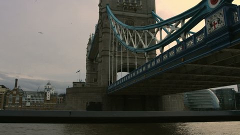 Tower Bridge in London. Low angle shot of the bridge in November 2015 with flags at half-mast. Shot in 4K (UHD)