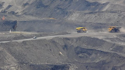 Mining dump trucks in the open pit mine