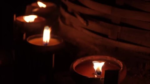 Candle light near bamboo column