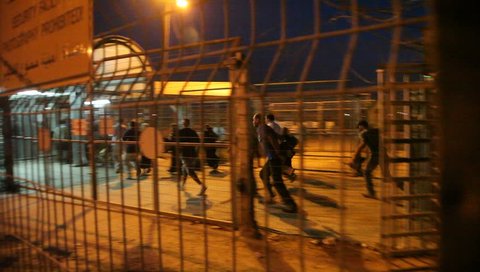 IRTAH, ISRAEL/PALESTINE - CIRCA 2014: Palestinians cross Checkpoint in a cage-like structure between Palestinian West Bank and state of Israel for work, medical care, education, religious reasons