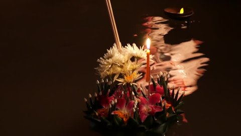 Floating Krathongs used to celebrate during Loy Krathong Festival in Thailand. Some of them are made of bread. It shows respect to the Goddess of water. の動画素材