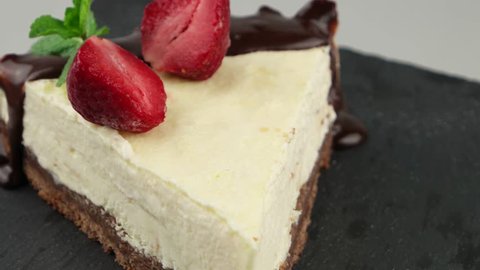 Delicious slice of chocolate cheesecake with strawberry