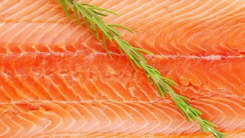 raw fresh uncooked salmon red fish fillet on black plate with rosemary twig 1920x1080 intro motion slow hidef hd