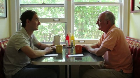 Father and son at a diner