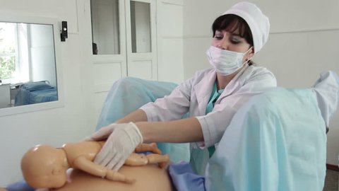 Training of obstetrician on a virtual mannequins simulator (delivery simulator)