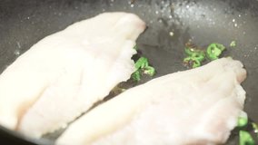 Cooking fish fillet in frying pan - Seafood dinner