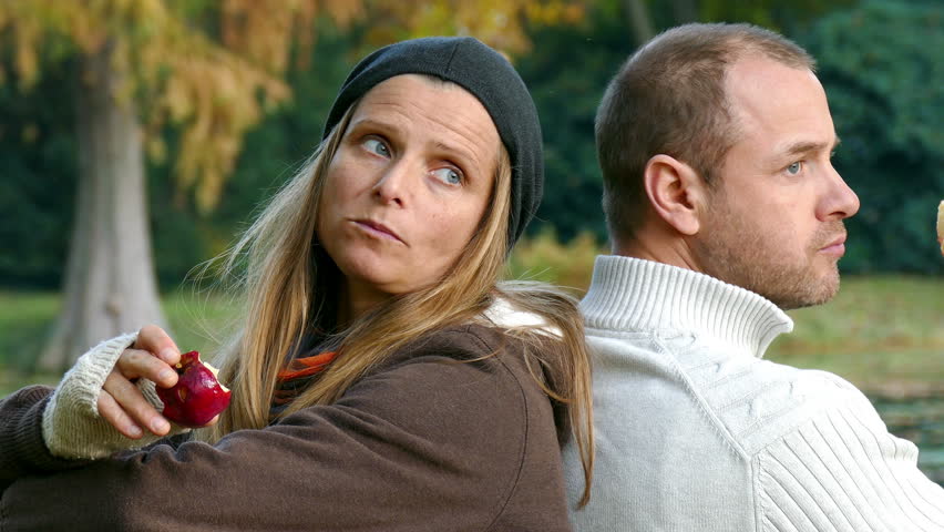 a man and a woman spending time together in a park/take a break/couple
