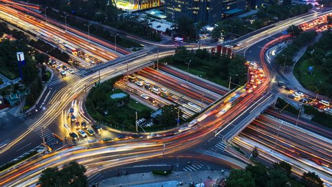 4K(4096x2304): Aerial View of freeway busy city rush hour heavy traffic jam highway. Timelapse of driving & cars racing by with streaking lights trail at night.