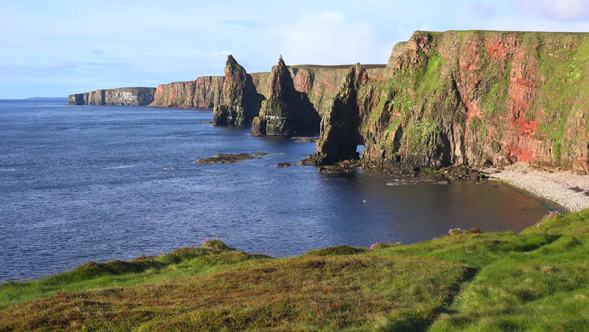 SCOTLAND - CIRCA 2015 - Establishing shot of the beautiful Duncansby Head sea stacks in Northern Scotland.