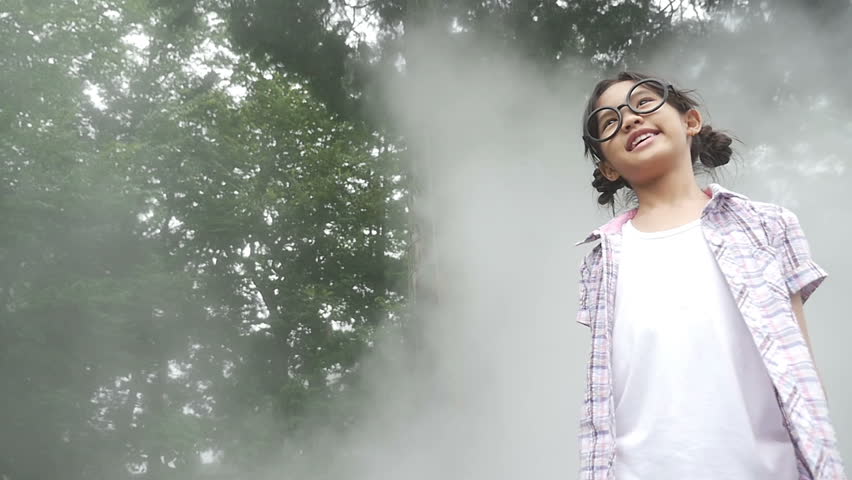Slow motion of Beautiful little Asian girl enjoy with nature in the park