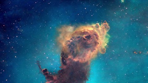 The viewer looks at a portion of the Carina nebula from different angles, its pillars of gas and dust can be seen in three dimensions.  Original image used with permission from NASA's Hubble site.  