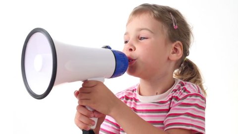 Girl holds loudspeaker near the mouth, then turns aside and says into it 