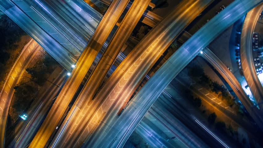 Static vertical top down aerial view of traffic on freeway interchange at night. 4K UHD timelapse background Royalty-Free Stock Footage #13085963