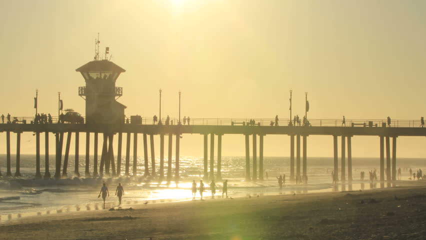 This is a stunning timelapse shot of the sun setting over the Huntington Beach