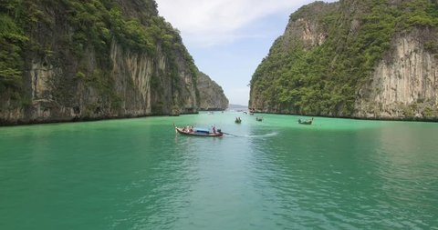 Stunning aerial shot of Phi Phi islands in Thailand with boats in foreground