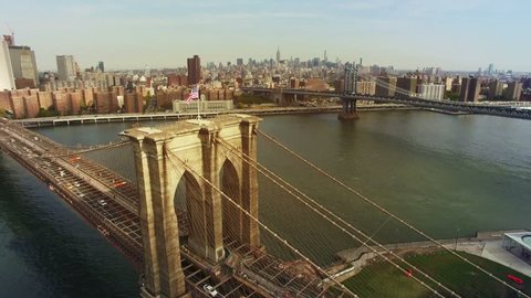 A toned aerial shot of Brooklyn Bridge, New York City. The camera is moving above Brooklyn bridge in the air approaching to Chinatown and upper Manhattan. 4K, Ultra HD video, DJI Phantom 3 pro.