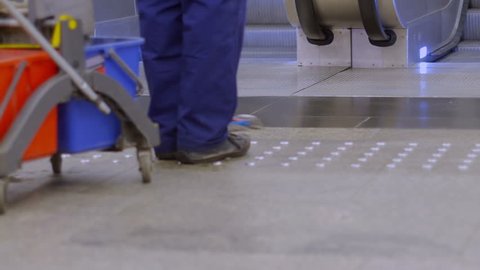 Cleaning floor in underground station.