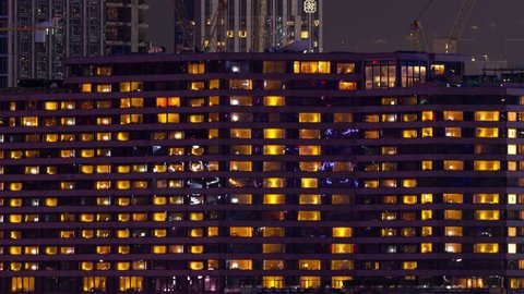 luxury hotel and windows at night in hong Kong City. Timelapse.