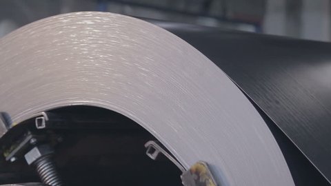 metal coil rotate on the machine close up