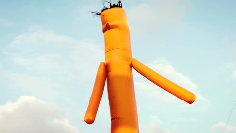 Inflatable waving tube man, generic advertising sign outside 