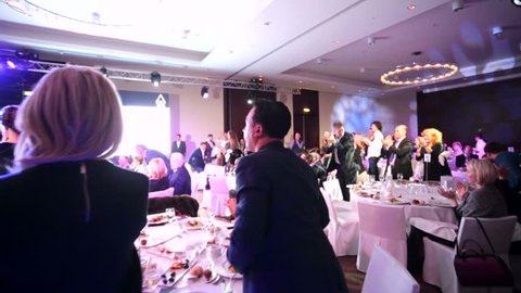 MOSCOW, RUSSIA - NOVEMBER 30, 2015: People stand and applaude during "Brand Awards 2015" ceremony. DOUBLETREE BY HILTON MOSCOW – MARINA hotel.