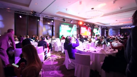 MOSCOW, RUSSIA - NOVEMBER 30, 2015: People sit at tables during "Brand Awards 2015" ceremony. DOUBLETREE BY HILTON MOSCOW – MARINA hotel.