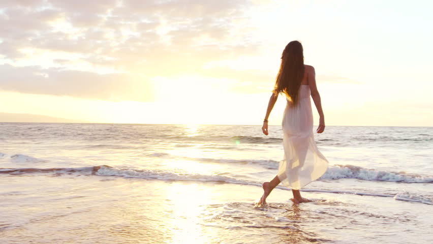 Happy Girl Having Fun at the Beach on Luxury Island at Sunset. Model Girl Spinning in SLOW MOTION Splashing Feet Wet. Royalty-Free Stock Footage #13121849