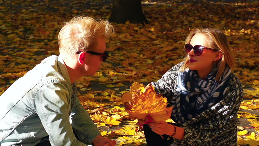Couple chatting in the autumnal park, steadycam shot, slow motion shot at 240fps
