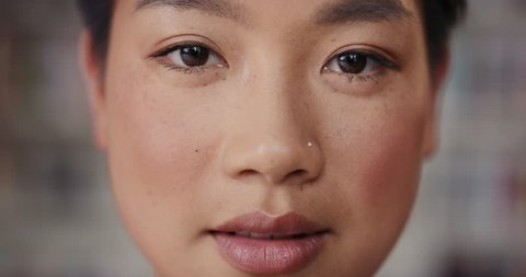 Dramatic Close up of beautiful Asian woman happy portrait happy smiling slow motion soft natural light on face center crop