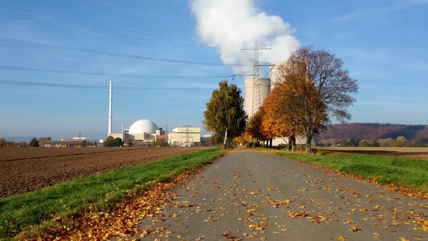 Nuclear power plant on the sky background in sunlight 