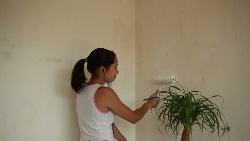 girl painting apartment