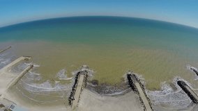 Flying over the beach. Aerial video.