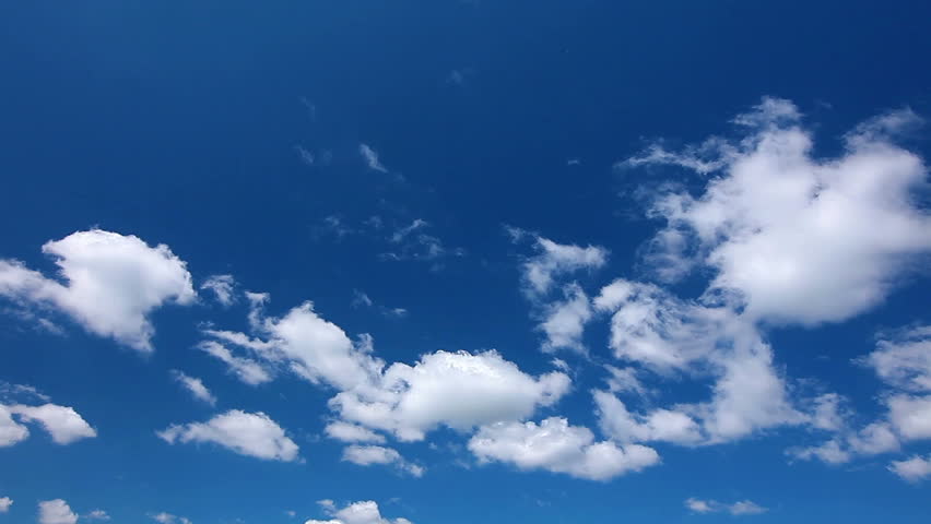 Time lapse clip of white fluffy clouds over blue sky Royalty-Free Stock Footage #1316707