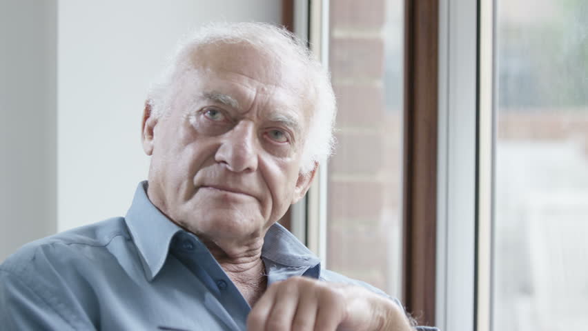 4K Portrait of sad elderly man sitting by the window. Shot on RED Epic. | Shutterstock HD Video #13175411