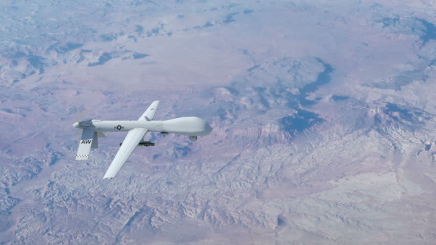 A Predator drone firing a hellfire missile.
