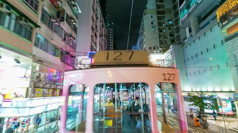 Moving tram in Hong Kong. Night street and tram. Timelapse 4k