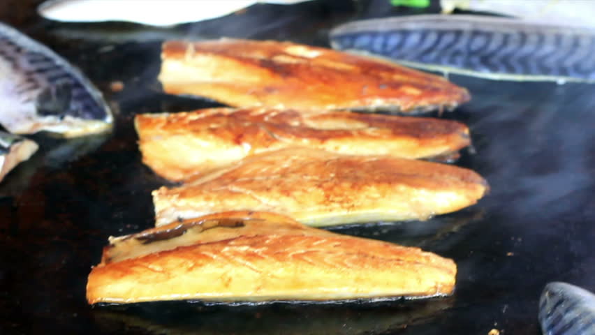 Bonito fish is frying in pan  
