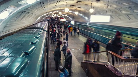 MOSCOW, RUSSIA - DECEMBER 6, 2015: Inside a Lenin Library metro station at rush hour. Unidentified people at the platform with moving trains. Time-lapse