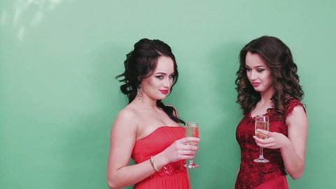 Portrait of elegant young women with a champagne glasses at celebration