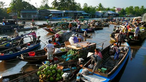Mekong Delta - May 2015: Floating market with vendors on boats. 4K resolution