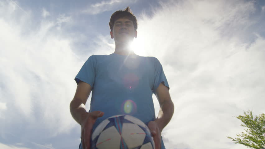 4K Portrait of young sports player showing off his ball control skills. Shot on RED Epic.