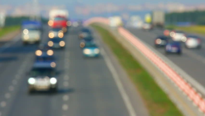 cars traveling on the highway - defocused