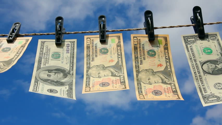 paper dollars are drying on rope