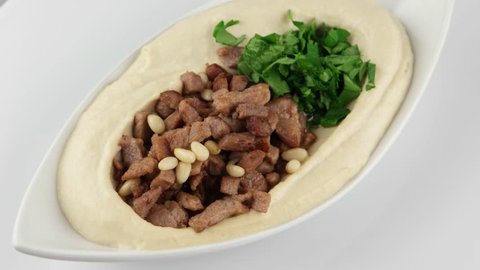 The hummus with meat and pine nuts