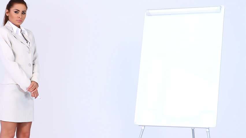 Adorable business woman showing two points at blank flipchart